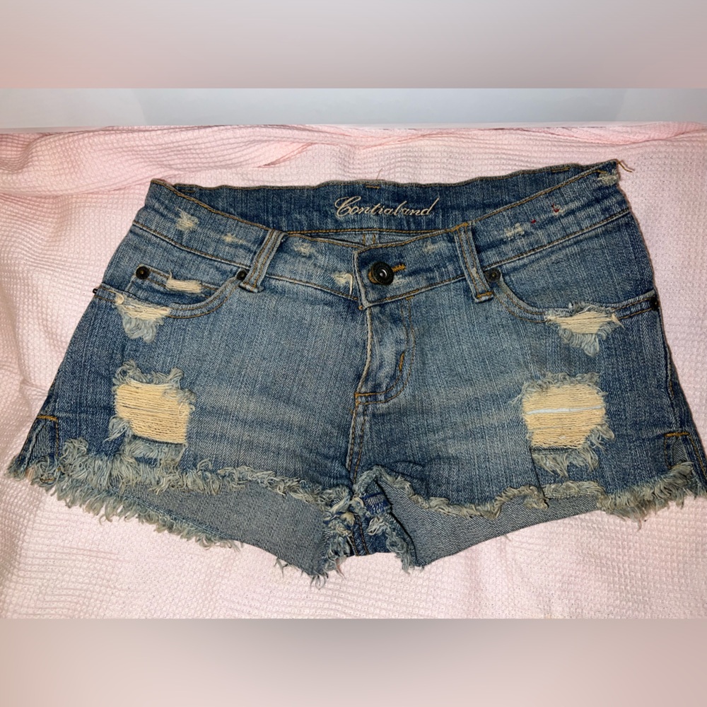 Low waist butt enhancing super stretch fringe distressed button ripped jeans